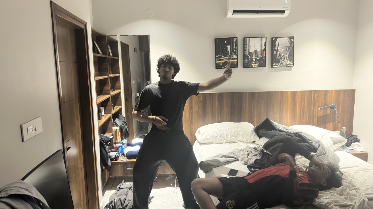 Krish Thakker posing in a bedroom